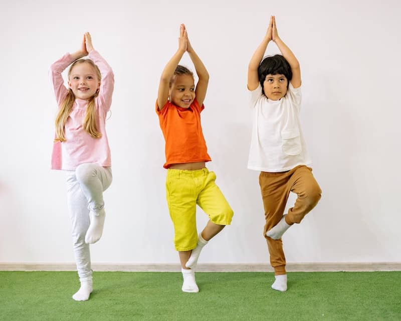 kids doing yoga - embodiment practices, embodied learning