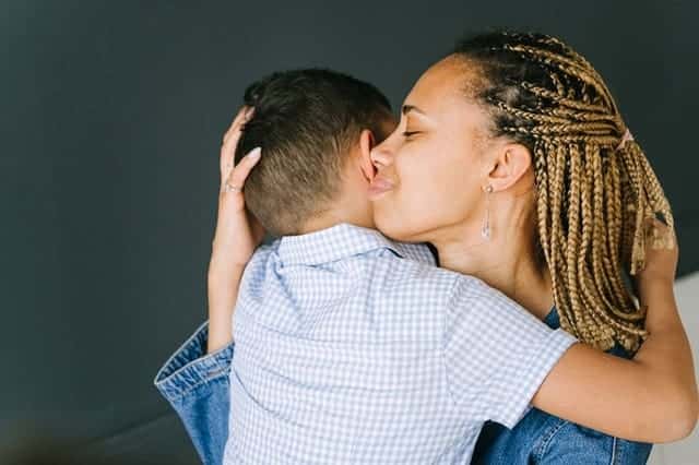 mother hugging child