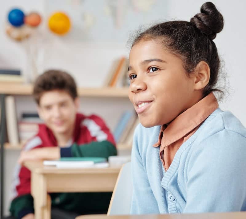 happy child in classroom - how to create a safe space