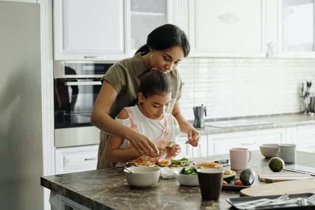 Mom with child cooking - confidence-building activities