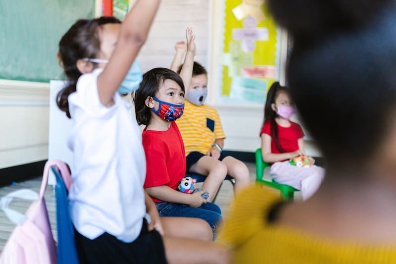 Children raising hands