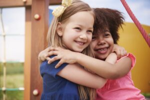 kids hugging - forgiveness