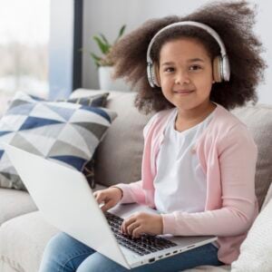 young girl on computer - online empathy for kids