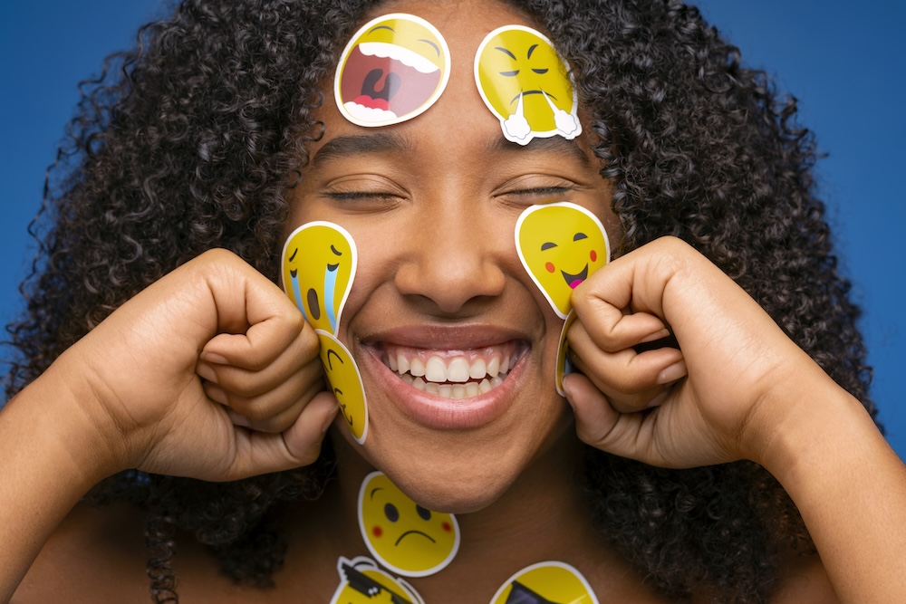 naming feelings - emoji stickers on girl's face